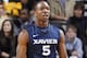 NASHVILLE, TN - NOVEMBER 28: Dezmine Wells #5 of the Xavier Musketeers celebrates after hitting a shot against the Vanderbilt Commodores at Memorial Gymnasium on November 28, 2011 in Nashville, Tennessee. Xavier defeated Vanderbilt 82-70 in overtime. (Photo by Joe Robbins/Getty Images)