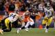 DENVER, CO - JANUARY 08: Tim Tebow #15 of the Denver Broncos scrambles to pass the ball to Demaryius Thomas #88 of the Denver Broncos to score an 80 yard touchdown in overtime of the AFC Wild Card Playoff game at Sports Authority Field against the Pittsburgh Steelers at Mile High on January 8, 2012 in Denver, Colorado. The Denver Broncos defeated the the Pittsburgh Steelers in overtime 23 - 29. (Photo by Jeff Gross/Getty Images)