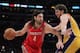 LOS ANGELES, CA - FEBRUARY 01: Luis Scola #4 of the Houston Rockets is defended by Pau Gasol #16 of the Los Angeles Lakers in the second half at Staples Center on February 1, 2011 in Los Angeles, California. The Lakers defeated the Rockets 114-106. NOTE TO USER: User expressly acknowledges and agrees that, by downloading and or using this photograph, User is consenting to the terms and conditions of the Getty Images License Agreement. (Photo by Jeff Gross/Getty Images)