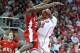 LOUISVILLE, KY - DECEMBER 23: Russ Smith #2 of the Louisville Cardinals shoots the ball while defended by Nigel Snipes #21 of the Western Kentucky Hilltoppers during the game at KFC YUM! Center on December 23, 2011 in Louisville, Kentucky. Louisville won 70-60. (Photo by Andy Lyons/Getty Images)