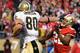 SAN FRANCISCO, CA - JANUARY 14: Jimmy Graham #80 of New Orleans Saints pushes away from Carlos Rogers #22 of the San Francisco 49ers and goes 66 yards for a touchdown in the fourth quarter during the NFC Divisional playoff game at Candlestick Park on January 14, 2012 in San Francisco, California. (Photo by Thearon W. Henderson/Getty Images)