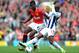 MANCHESTER, ENGLAND - MARCH 11: Paul Pogba of Manchester United is challenged by Marc-Antoine Fortune of West Bromwich Albionduring the Barclays Premier League match between Manchester United and West Bromwich Albion at Old Trafford on March 11, 2012 in Manchester, England. (Photo by Michael Regan/Getty Images)