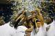 NEW ORLEANS, LA - MARCH 11: The Vanderbilt Commodores celebrate with the trophy after their 71 to 64 win over the Kentucky Wildcats in the championship game of the 2012 SEC Men's Basketball Tournament at New Orleans Arena on March 11, 2012 in New Orleans, Louisiana. (Photo by Chris Graythen/Getty Images)