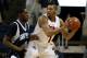 BRIDGEPORT, CT - MARCH 07: Mike Glover #1 of the Iona Gaels looks to pass as he is defended by Ryan Bacon #4 of the St. Peter's Peacocks during the final of the MAAC men's conference basketball tournment at Webster Bank Arena at Harbor Yard on March 7, 2011 in Bridgeport, Connecticut. (Photo by Chris Chambers/Getty Images)