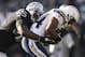 OAKLAND, CA - JANUARY 01: Curtis Brinkley #44 of the San Diego Chargers is tackled by Rolando McClain #55 of the Oakland Raiders at O.co Coliseum on January 1, 2012 in Oakland, California. (Photo by Ezra Shaw/Getty Images)