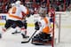 WASHINGTON, DC - MARCH 04: Goalie Ilya Bryzgalov #30 of the Philadelphia Flyers makes a save against the Washington Capitals during the third period at the Verizon Center on March 4, 2012 in Washington, DC. (Photo by Rob Carr/Getty Images)