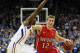 KANSAS CITY, MO - DECEMBER 19: Nik Cochran #12 of the Davidson Wildcats drives as Tyshawn Taylor #10 of the Kansas Jayhawks defends during the game on December 19, 2011 at the Sprint Center in Kansas City, Missouri. (Photo by Jamie Squire/Getty Images)