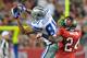 TAMPA, FL - DECEMBER 17: Wide receiver Laurent Robinson #81 of the Dallas Cowboys grabs a midfield pass against the Tampa Bay Buccaneers December 17, 2011 at Raymond James Stadium in Tampa, Florida. (Photo by Al Messerschmidt/Getty Images)