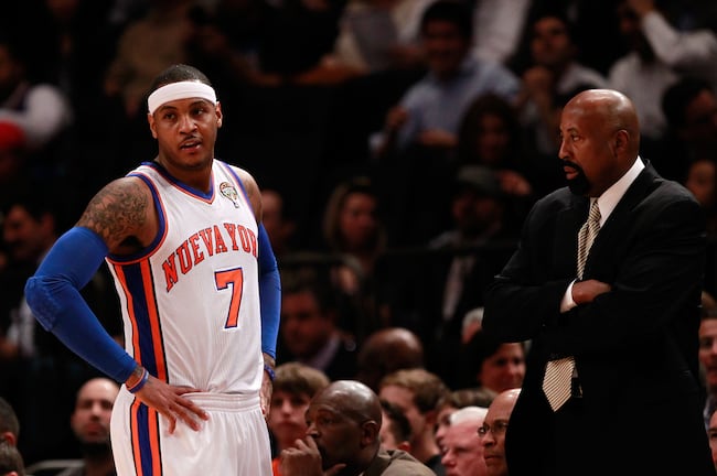 Carmelo Anthony and his new head coach Mike Woodson confer during tonight's game.