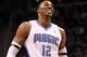 ORLANDO, FL - MARCH 13: Dwight Howard #12 of the Orlando Magic smiles during the game against the Miami Heat at Amway Center on March 13, 2012 in Orlando, Florida. NOTE TO USER: User expressly acknowledges and agrees that, by downloading and or using this photograph, User is consenting to the terms and conditions of the Getty Images License Agreement. (Photo by Sam Greenwood/Getty Images)