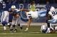 INDIANAPOLIS, IN - DECEMBER 18: Donald Brown #31 of the Indianapolis Colts avoids the tackle of Jason Jones #91 of the Tennessee Titans during their game at Lucas Oil Stadium on December 18, 2011 in Indianapolis, Indiana. The Colts defeated the Titans 27-13. (Photo by John Grieshop/Getty Images)