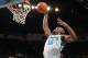 NEW ORLEANS, LA - DECEMBER 30: Emeka Okafor #50 of the New Orleans Hornets dunks the ball over Marcin Gortat #4 of the Phoenix Suns at New Orleans Arena on December 30, 2011 in New Orleans, Louisiana. NOTE TO USER: User expressly acknowledges and agrees that, by downloading and or using this photograph, User is consenting to the terms and conditions of the Getty Images License Agreement. (Photo by Chris Graythen/Getty Images)