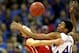 KANSAS CITY, MO - DECEMBER 19: Kevin Young #40 of the Kansas Jayhawks battles Tyler Kalinoski #4 of the Davidson Wildcats for a rebound during the game on December 19, 2011 at the Sprint Center in Kansas City, Missouri. (Photo by Jamie Squire/Getty Images)