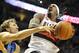 PORTLAND, OR - APRIL 28: Gerald Wallace #3 of the Portland Trail Blazers is fouled by Dirk Nowitzki #41 of the Dallas Mavericks during the fourth quarter of Game Six of the Western Conference Quartefinals in the 2011 NBA Playsoffs on April 28, 2011 at the Rose garden in Portland, Oregon. The Mavericks won the game 103-96 to win the series and advance. NOTE TO USER: User expressly acknowledges and agrees that, by downloading and or using this photograph, User is consenting to the terms and conditions of the Getty Images License Agreement. (Photo by Steve Dykes/Getty Images)
