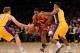 LOS ANGELES, CA - JANUARY 13: Ramon Sessions #3 of the Cleveland Cavaliers drives between Darius Morris #1 and Troy Murphy #14 of the Los Angeles Lakers at Staples Center on January 13, 2012 in Los Angeles, California. The Lakers won 97-92. NOTE TO USER: User expressly acknowledges and agrees that, by downloading and or using this photograph, User is consenting to the terms and conditions of the Getty Images License Agreement. (Photo by Stephen Dunn/Getty Images)