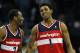 CHARLOTTE, NC - JANUARY 28: Teammates Nick Young #1 and John Wall #2 of the Washington Wizards react to a play on their way to defeating the Charlotte Bobcats 102-99 during their game at Time Warner Cable Arena on January 28, 2012 in Charlotte, North Carolina. NOTE TO USER: User expressly acknowledges and agrees that, by downloading and or using this photograph, User is consenting to the terms and conditions of the Getty Images License Agreement. (Photo by Streeter Lecka/Getty Images)