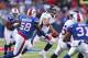 ORCHARD PARK, NY - DECEMBER 24: Tim Tebow #15 of the Denver Broncos scrambles against the Buffalo Bills at Ralph Wilson Stadium on December 24, 2011 in Orchard Park, New York. Buffalo won 40-14. (Photo by Rick Stewart/Getty Images)