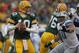 GREEN BAY, WI - JANUARY 01: Matt Flynn #10 of the Green Bay Packerslooks for a receiver as Ndamukong Suh #90 of the Detroit Lions rushes at Lambeau Field on January 1, 2012 in Green Bay, Wisconsin. The Packers defeated the Lions 45-41. (Photo by Jonathan Daniel/Getty Images)