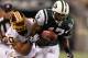 EAST RUTHERFORD, NJ - AUGUST 27: Braylon Edwards #17 of the New York Jets is tackled by LaRon Landry #30 of the Washington Redskins during their preseason game on August 27, 2010 at the New Meadowlands Stadium in East Rutherford, New Jersey. (Photo by Al Bello/Getty Images)