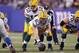 EAST RUTHERFORD, NJ - DECEMBER 04: Aaron Rodgers #12 of the Green Bay Packers calls signals out as he stands at the line of scrimmage behind center Scott Wells #63 of the Green Bay Packers against the New York Giants at MetLife Stadium on December 4, 2011 in East Rutherford, New Jersey. The Packers won 38-35. (Photo by Nick Laham/Getty Images)