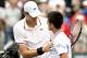 INDIAN WELLS, CA - MARCH 17: John Isner is congratulated by Novak Djokovic of Serbia after their match during the semifinal of the BNP Paribas Open at the Indian Wells Tennis Garden on March 17, 2012 in Indian Wells, California. (Photo by Matthew Stockman/Getty Images)