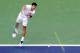 INDIAN WELLS, CA - MARCH 17: Novak Djokovic of Serbia serves during his 7-6(7), 3-6, 7-6(5) loss to John Isner at the Indian Wells Tennis Garden on March 17, 2012 in Indian Wells, California. (Photo by Harry How/Getty Images)