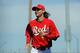 GOODYEAR, AZ - MARCH 14: Pitcher Bronson Arroyo #61 of the Cincinnati Reds runs from the bullpen to the dugout during a spring training baseball game against the San Diego Padres at Goodyear Ballpark on March 14, 2012 in Goodyear, Arizona. (Photo by Kevork Djansezian/Getty Images)