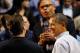 DAYTON, OH - MARCH 13: U.S. President Barack Obama (R) smiles as he is interviewed by broadcaster Clark Kellogg (C) along with British Prime Minister David Cameron at half time of the Western Kentucky Hilltoppers and Mississippi Valley State Delta Devils game with at UD Arena in the first round of the 2011 NCAA men's basketball tournament on March 13, 2012 in Dayton, Ohio. (Photo by Gregory Shamus/Getty Images)