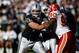 OAKLAND, CA - OCTOBER 21: Guard Cooper Carlisle #66 of the Oakland Raiders tries to hold off defensive tackle Turk McBride #90 of the Kansas City Chiefs at McAfee Coliseum on October 21, 2007 in Oakland, California. Kansas City won 12-10. (Photo by Allen Kee/Getty Images)
