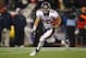 FOXBORO, MA - JANUARY 14: Tim Tebow #15 of the Denver Broncos runs the ball against the New England Patriots during their AFC Divisional Playoff Game at Gillette Stadium on January 14, 2012 in Foxboro, Massachusetts. (Photo by Al Bello/Getty Images)