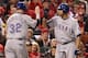 ST LOUIS, MO - OCTOBER 28: (L-R) Josh Hamilton #32 of the Texas Rangers celebrates with Nelson Cruz #17 after scoring on an RBI double by Michael Young #10 in the first inning during Game Seven of the MLB World Series against the St. Louis Cardinals at Busch Stadium on October 28, 2011 in St Louis, Missouri. (Photo by Jamie Squire/Getty Images)