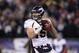 FOXBORO, MA - JANUARY 14: Tim Tebow #15 of the Denver Broncos looks to pass against the New England Patriots during their AFC Divisional Playoff Game at Gillette Stadium on January 14, 2012 in Foxboro, Massachusetts. (Photo by Elsa/Getty Images)