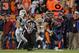 DENVER, CO - NOVEMBER 17: Quarterback Tim Tebow #15 of the Denver Broncos eludes Eric Smith #33 of the New York Jets and rushes 20 yards for a touchdown in the fourth quarter at Sports Authority Field at Mile High on November 17, 2011 in Denver, Colorado. The Broncos defeated the Jets 17-13. (Photo by Doug Pensinger/Getty Images)