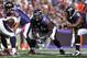 BALTIMORE, MD - OCTOBER 10: Ben Grubbs #66 of the Baltimore Ravens defends against the Denver Broncos at M&T Bank Stadium on October 10, 2010 in Baltimore, Maryland. Players wore pink in recognition of Breast Cancer Awareness Month. The Ravens defeated the Broncos 31-17. (Photo by Larry French/Getty Images)