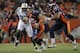DENVER, CO - NOVEMBER 17: Quarterback Tim Tebow #15 of the Denver Broncos scrambles with the ball as Orlando Franklin #74 of the Denver Broncos blocks against Calvin Pace #97 of the New York Jets at Sports Authority Field at Mile High on November 17, 2011 in Denver, Colorado. The Broncos defeated the Jets 17-13. (Photo by Doug Pensinger/Getty Images)