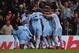 MANCHESTER, ENGLAND - MARCH 21: Samir Nasri of Manchester City (obscured) is mobbed by team mates as he scores their second goal during the Barclays Premier League match between Manchester City and Chelsea at the Etihad Stadium on March 21, 2012 in Manchester, England. (Photo by Alex Livesey/Getty Images)