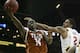 KANSAS CITY, MO - MARCH 08: J'Covan Brown #14 of the Texas Longhorns shoots past Chris Babb #2 of the Iowa State Cyclones during the quarterfinals of the Big 12 Basketball Tournament March 8, 2012 at Sprint Center in Kansas City, Missouri. Texas won 71-65. (Photo by Ed Zurga/Getty Images)