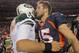 DENVER, CO - NOVEMBER 17: Quarterback Mark Sanchez #6 of the New York Jets and quarterback Tim Tebow #15 of the Denver Broncos meet at midfield after the Broncos defeated the Jets 17-13 at Sports Authority Field at Mile High on November 17, 2011 in Denver, Colorado. Tim Tebow scored the game winning touchdown with 58 seconds remaining in the game. (Photo by Doug Pensinger/Getty Images)