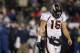 FOXBORO, MA - JANUARY 14: Tim Tebow #15 of the Denver Broncos walks towards the sideline with his head down in the second half against the New England Patriots during their AFC Divisional Playoff Game at Gillette Stadium on January 14, 2012 in Foxboro, Massachusetts. (Photo by Jim Rogash/Getty Images)