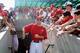 TEMPE, AZ - MARCH 10: Mark Trumbo #44 of the Los Angeles Angels of Anaheim walks out onto the field past fans before the spring training game against the San Francisco Giants at Tempe Diablo Stadium on March 10, 2012 in Tempe, Arizona. (Photo by Christian Petersen/Getty Images)