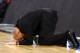 ST. LOUIS, MO - MARCH 23: Head coach John Groce of the Ohio Bobcats lies on the court dejected as he reacts late in the game against the North Carolina Tar Heels during the 2012 NCAA Men's Basketball Midwest Regional Semifinal at Edward Jones Dome on March 23, 2012 in St. Louis, Missouri. (Photo by Dilip Vishwanat/Getty Images)