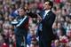 LIVERPOOL, ENGLAND - MARCH 24: Roberto Martinez of Wigan gives instructions in front of Kenny Dalglish of Liverpool during the Barclays Premier League match between Liverpool and Wigan Athletic at Anfield on March 24, 2012 in Liverpool, England. (Photo by Laurence Griffiths/Getty Images)