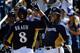 PHOENIX, AZ - MARCH 08: Ryan Braun #8 of the Milwaukee Brewers celebrates his two-run home run with Rickie Weeks #23, who scored on the play, during the third inning of a spring training baseball game against the Cincinnati Reds at Maryvale Baseball Park on March 8, 2012 in Phoenix, Arizona. (Photo by Kevork Djansezian/Getty Images)