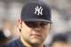 NEW YORK, NY - JUNE 09: Joba Chamberlain #62 of the New York Yankees watches on from the dugout against the Boston Red Sox on June 9, 2011 at Yankee Stadium in the Bronx borough of New York City. (Photo by Nick Laham/Getty Images)