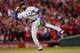 ST LOUIS, MO - OCTOBER 28: Elvis Andrus #1 of the Texas Rangers throws to first on an infield single by Lance Berkman #12 of the St. Louis Cardinals in the seventh inning during Game Seven of the MLB World Series at Busch Stadium on October 28, 2011 in St Louis, Missouri. (Photo by Jamie Squire/Getty Images)