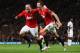 MANCHESTER, ENGLAND - MARCH 26: Wayne Rooney of Manchester United (L) celebrates with Jonny Evans as he scores their first goal during the Barclays Premier League match between Manchester United and Fulham at Old Trafford on March 26, 2012 in Manchester, England. (Photo by Alex Livesey/Getty Images)