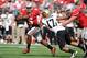COLUMBUS, OH - SEPTEMBER 24: Quarterback Braxton Miller #5 of the Ohio State Buckeyes can't elude the grasp of Josh Hartigan #17 of the Colorado Buffaloes in the first quarter at Ohio Stadium on September 24, 2011 in Columbus, Ohio. (Photo by Jamie Sabau/Getty Images)
