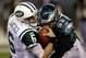 Babin sacks Jets quarterback Mark Sanchez.