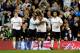 LONDON, ENGLAND - MARCH 27: Ryan Nelsen (2nd R) of Spurs is congratulated by Jermain Defoe (2nd L) after scoring the opening goal as teammates Luka Modric (L) and Benoit Assou-Ekotto (R) look on during the FA Cup sixth round match between Tottenham Hotspur and Bolton Wanderers at White Hart Lane on March 27, 2012 in London, England. (Photo by Mike Hewitt/Getty Images)