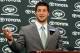 FLORHAM PARK, NJ - MARCH 26: Quarterback Tim Tebow addresses the media as he is introduced as a New York Jet at the Atlantic Health Jets Training Center on March 26, 2012 in Florham Park, New Jersey. Tebow, traded from the Denver Broncos last week, will be the team's backup quarterback according to Jets head coach Rex Ryan. Tebow, the 2007 Heisman Trophy winner, started 11 games in 2011 for Denver and finished with a 7-4 record as a starter. He led the Broncos to a playoff overtime win against the Pittsburgh Steelers in the first round before eventually losing to the New England Patriots in the next round. (Photo by Mike Stobe/Getty Images)